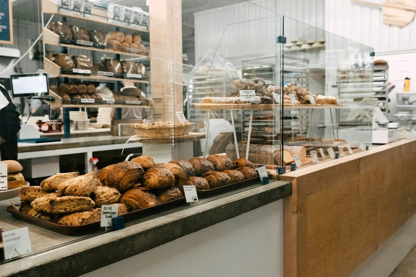 A bakery case full of fresh bread and pastries