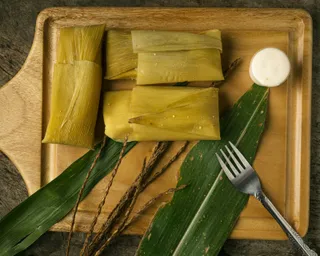 Tamales on a wooden board