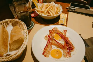 Bacon and eggs with fries and toast